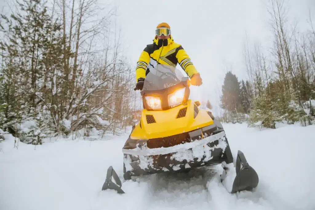 Man riding snowmobile