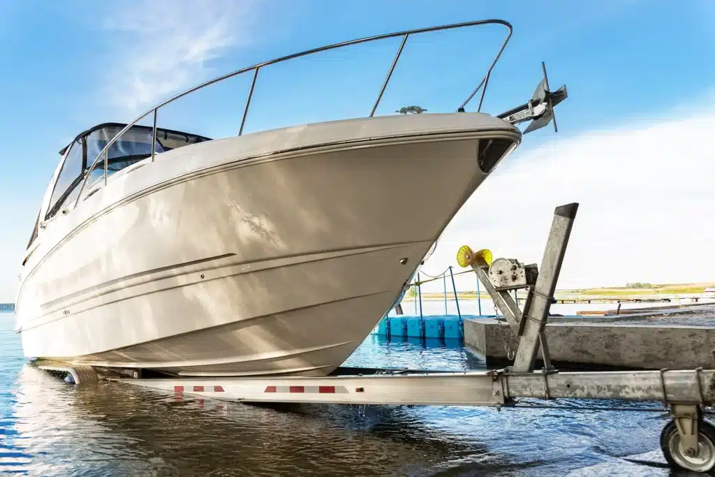 Big luxury cabin motorboat at launch ramp