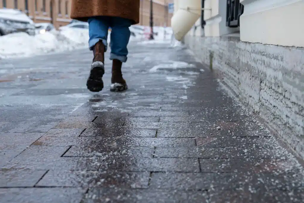 Person walking on icy sidewalk