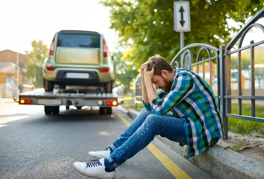 Unhappy man's car is towed