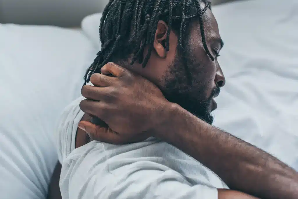 Young man suffering from neck pain