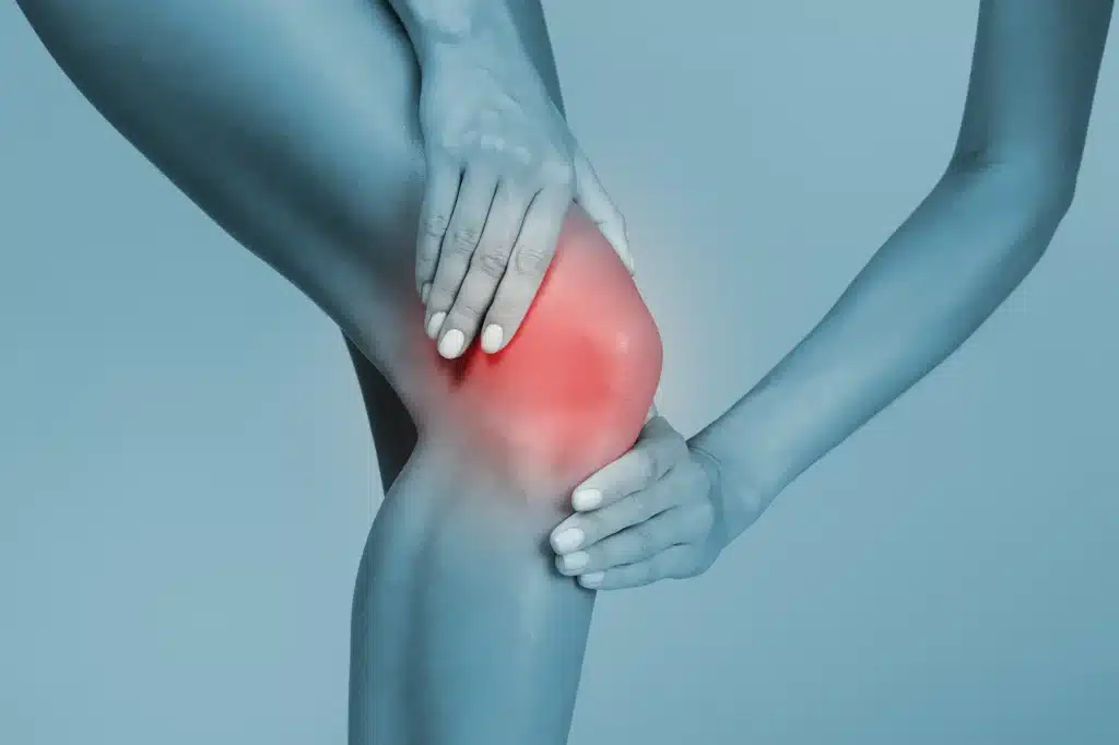 person suffering from knee pain