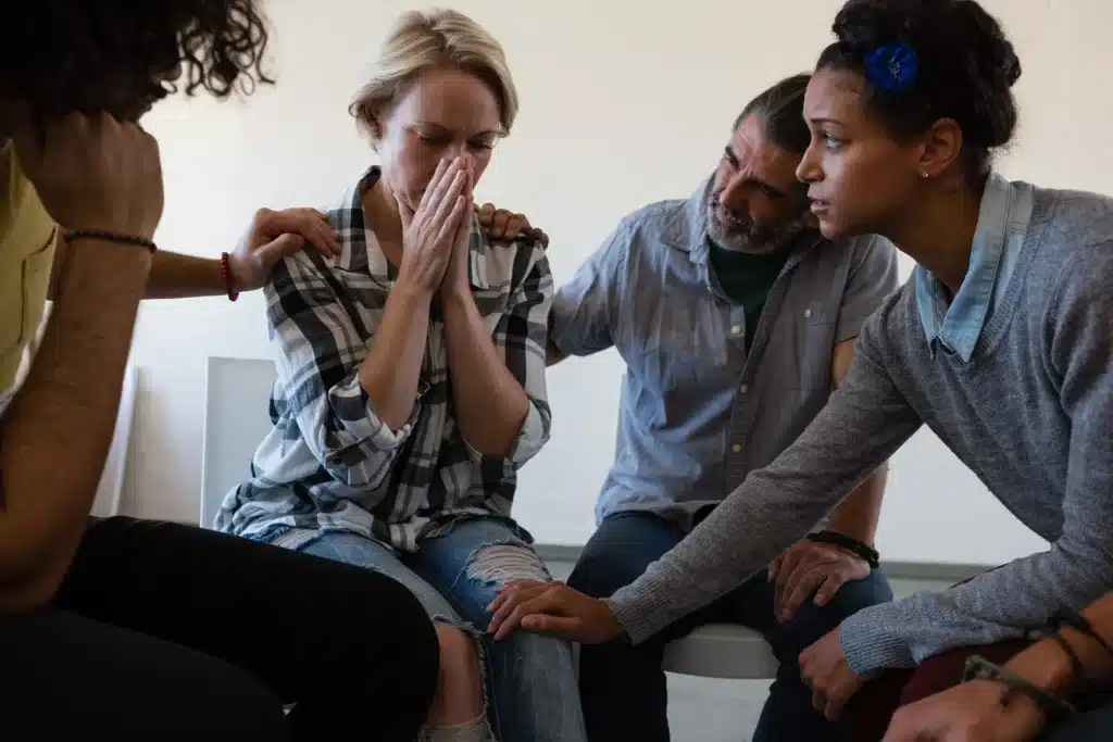 friends consoling worried woman