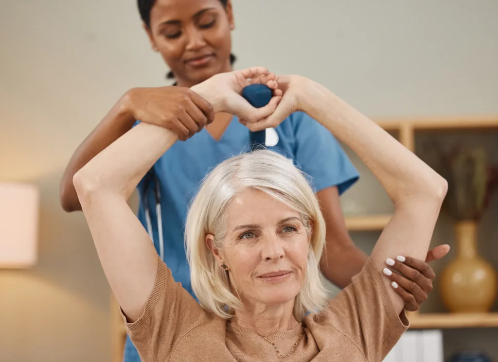 Senior using dumbbells