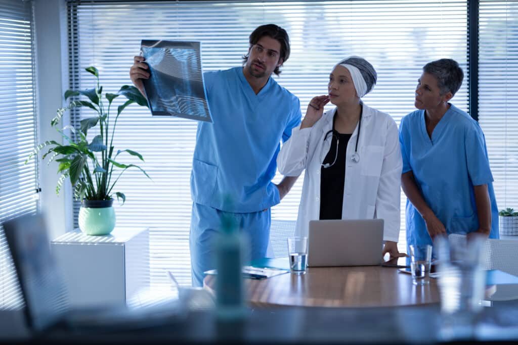 surgeons looking at scans